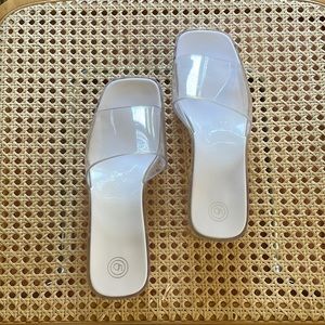 Urban outfitters clear “jelly” sandals/heels.